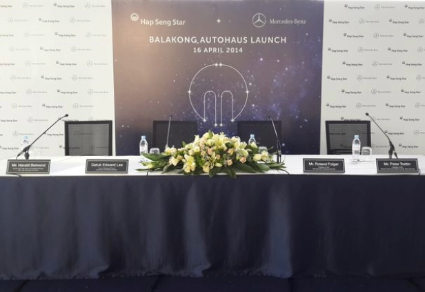 Affordable press meet planning Chennai — branded podium, media setup and audience seating at a Chennai venue