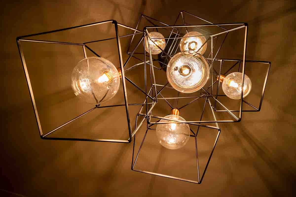 Elegant ambient lighting Chennai wedding reception with warm LED uplights and fairy light canopy