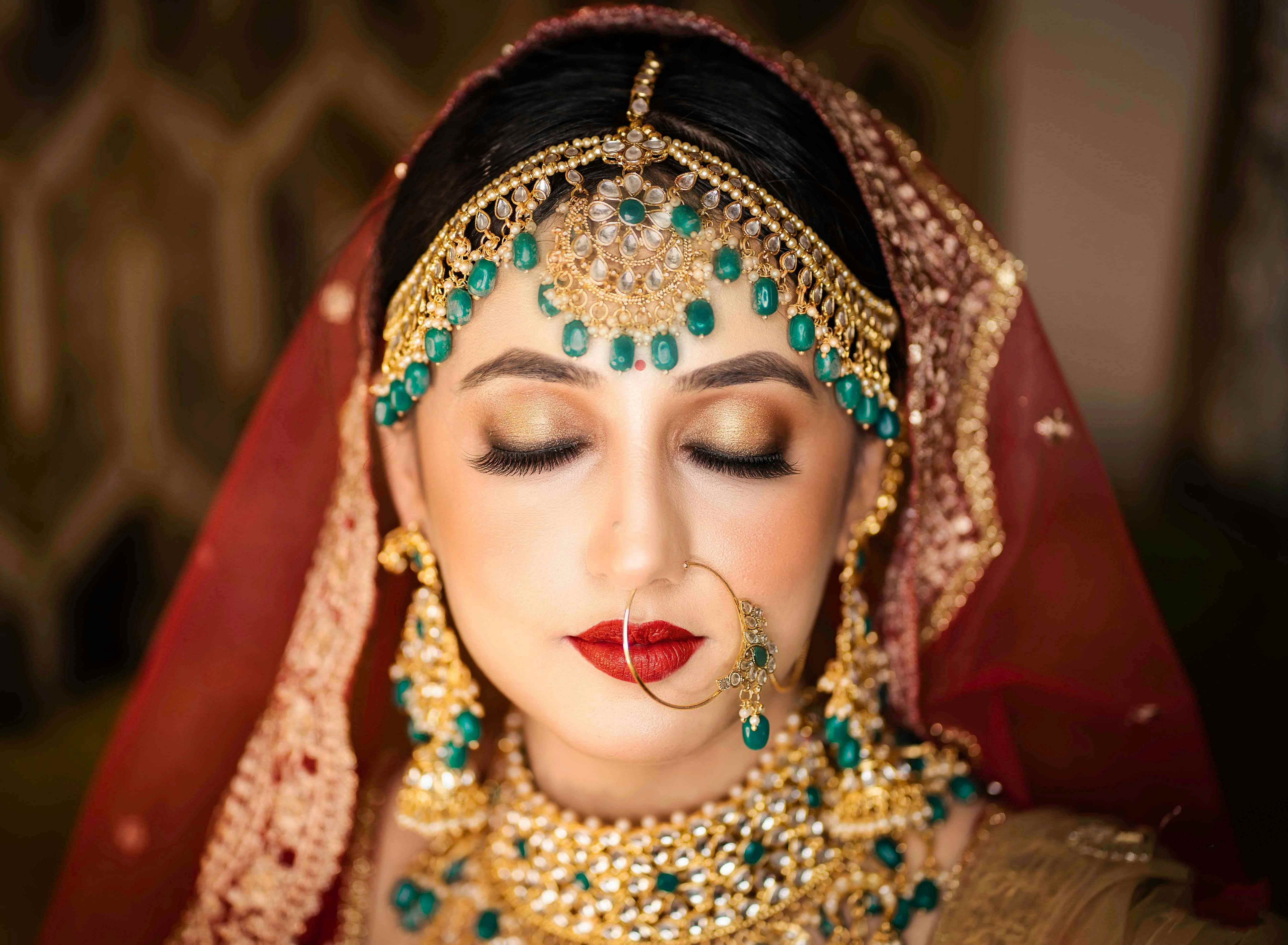 Beautiful bride getting professional makeup done as part of her pre-bridal package