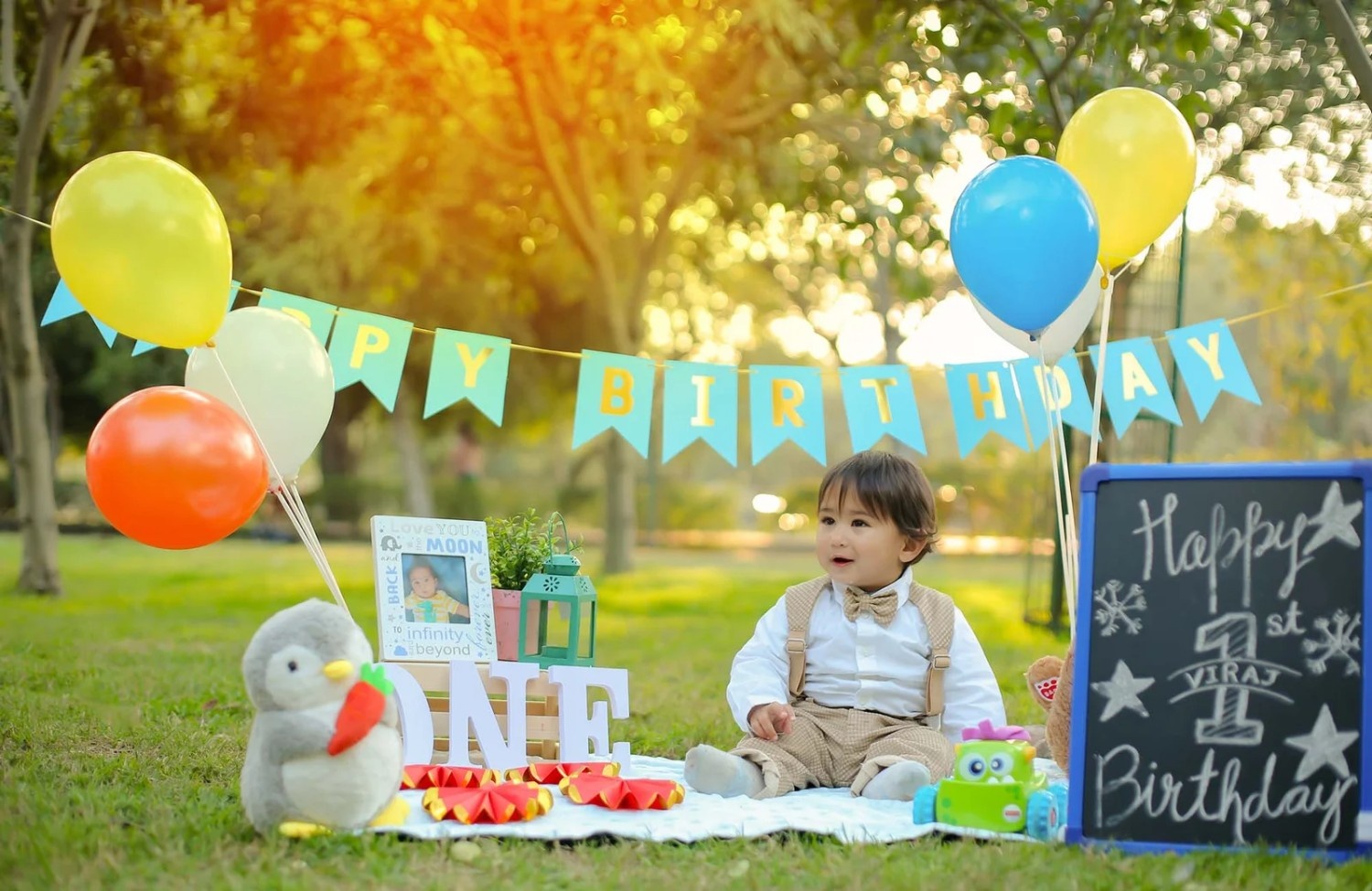 Professional birthday photography setup with colorful decorations and camera equipment