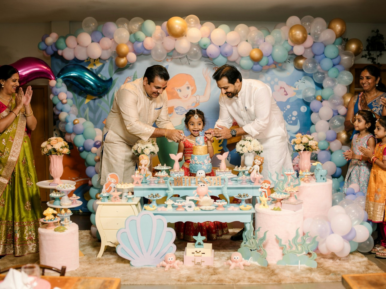 Colorful birthday photography props including signs, frames, and themed decorations
