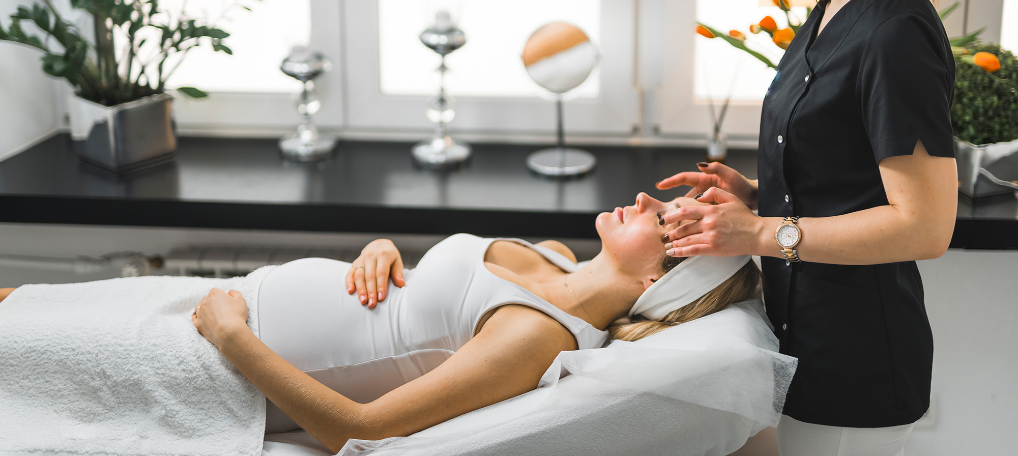 Bride getting body polishing treatment at luxury spa for wedding preparation