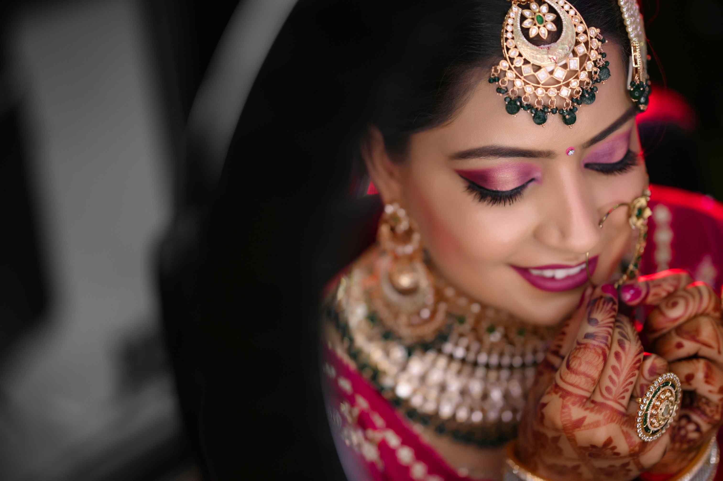 Bride checking makeup longevity throughout the day with before and after photos