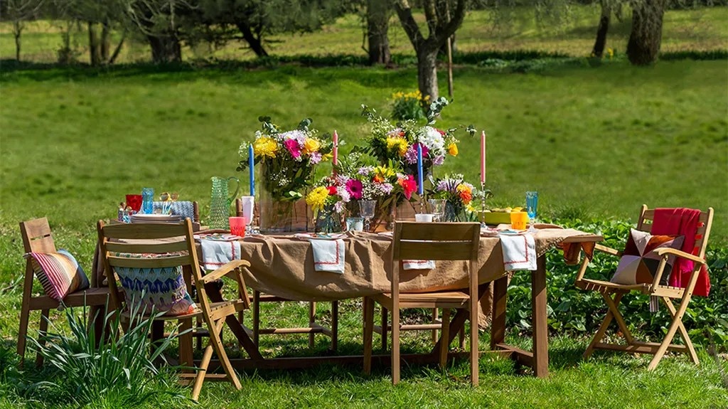 Rustic themed party setup with natural elements, wooden decorations, and budget-friendly styling