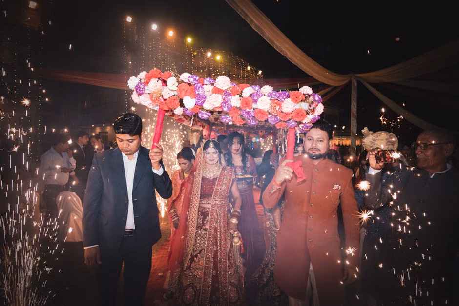 Professional celebrity appearances at events with stage lighting and audience engagement at Indian wedding celebration