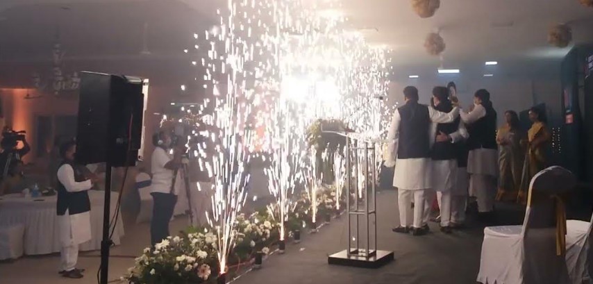 Cold fireworks display at a Chennai wedding venue with golden sparks illuminating the mandap