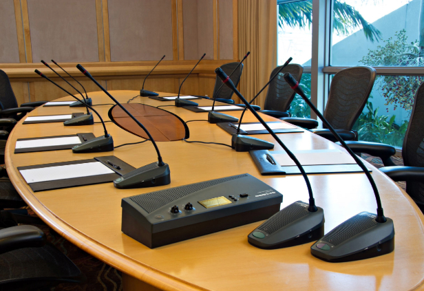 Professional conference sound system Chennai setup at a corporate event venue with microphones and speaker arrays