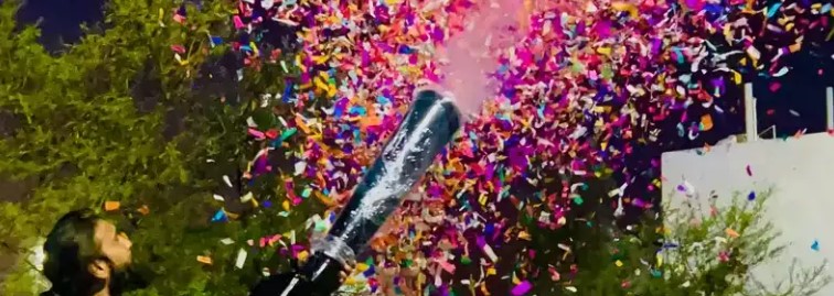 Colourful confetti blast Chennai wedding celebration with streamers and cannons at a banquet hall