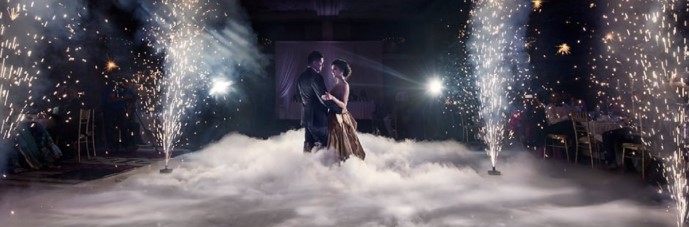 Couple Entry Dry Ice Chennai — bride and groom walking through a dramatic low-lying fog cloud at a Chennai wedding reception