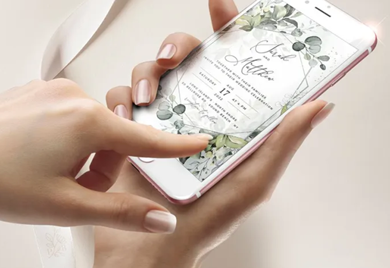 Modern smartphone displaying beautiful animated digital wedding invitation with interactive elements