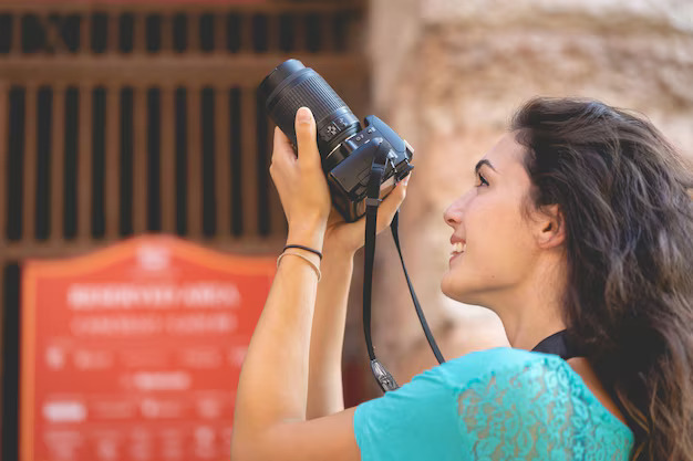 Professional event photographer capturing wedding moments with premium camera equipment