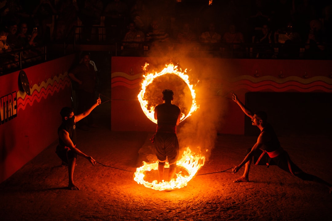 Fire Dance Performances: Safety Tips, Costs & Best Event Types - professional fire dancer performing at an outdoor wedding celebration with safety measures in place