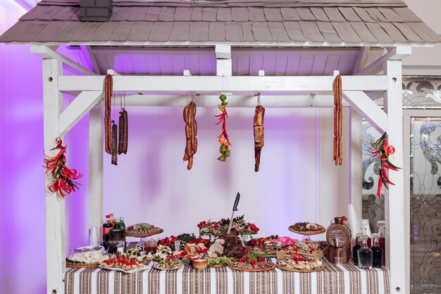 Colorful wedding game stalls with guests enjoying various activities at an Indian wedding celebration