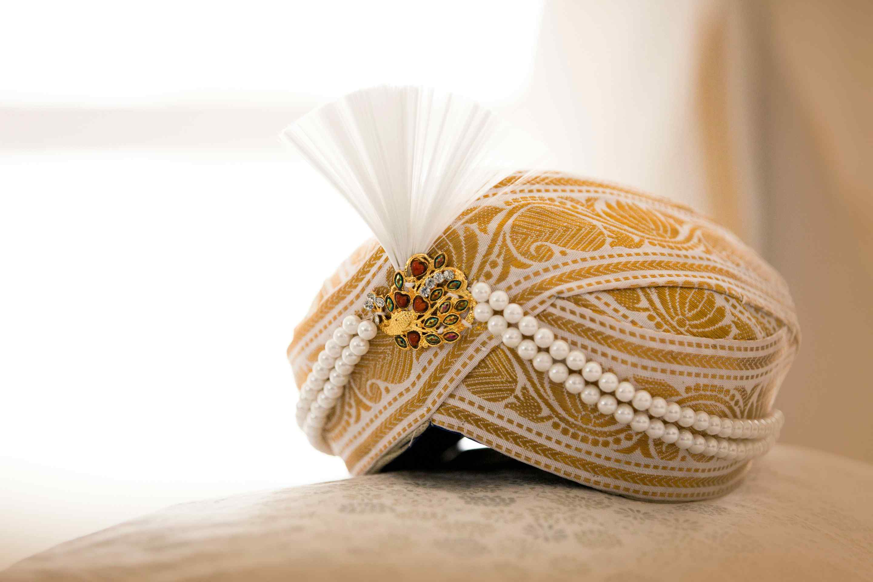Traditional Indian groom accessories including kalgi, sehra, and ornate jewelry