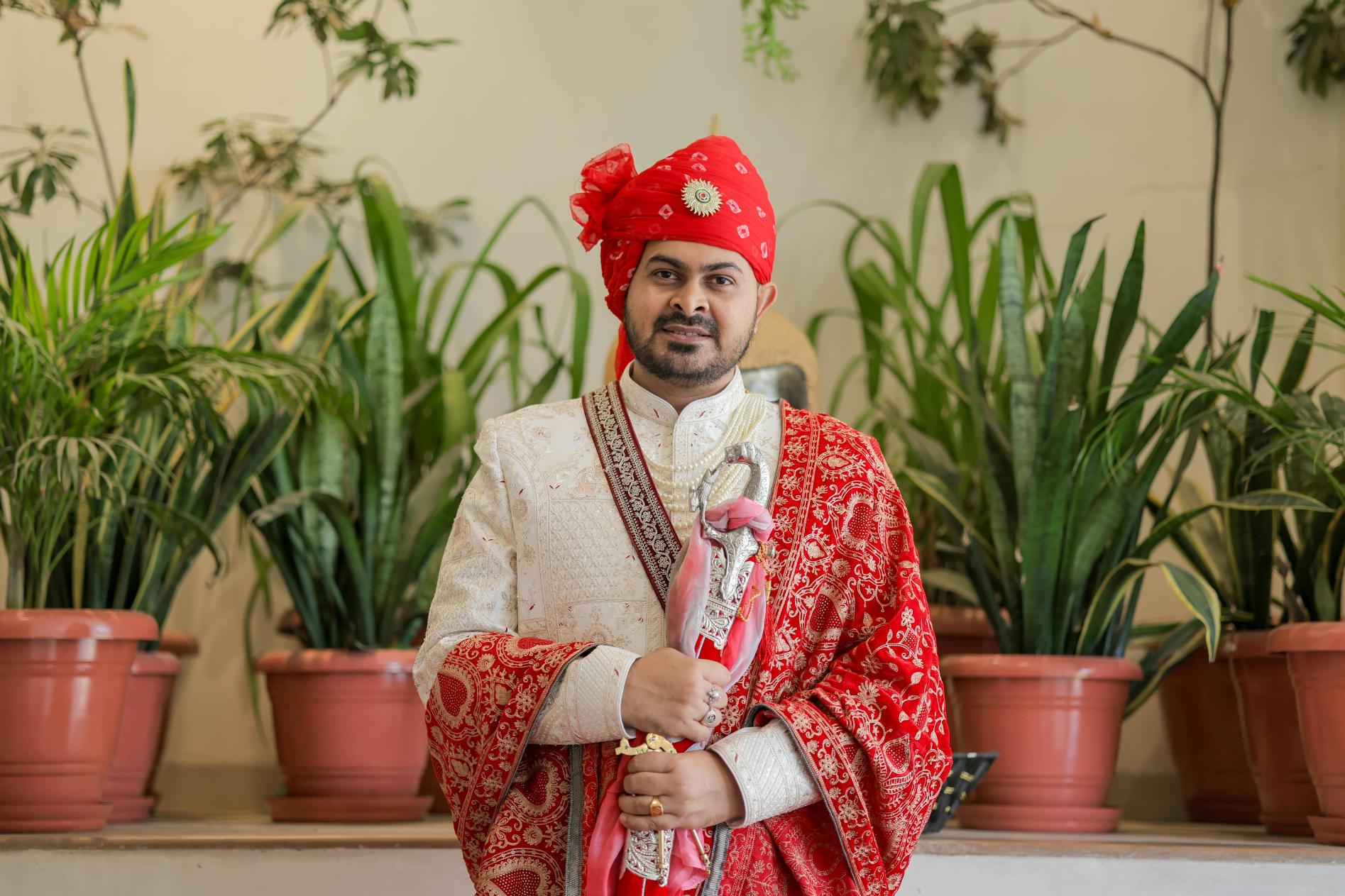 Groom's complete wedding ensemble with coordinated safa, sherwani, and traditional accessories