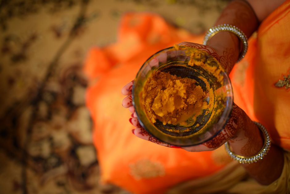 Traditional haldi ceremony setup in Chennai with marigold decorations and brass vessels