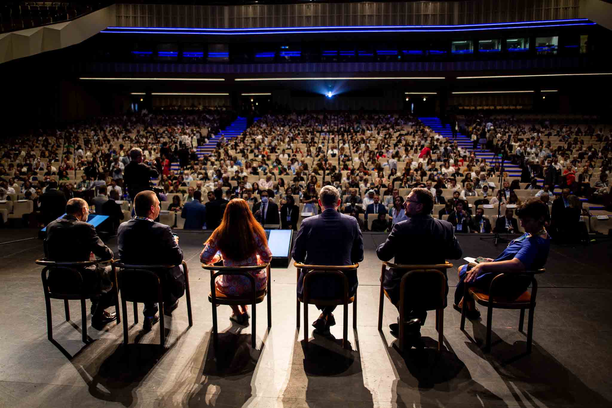 How much does a conference cost in Chennai — conference hall setup with projector, seating, and branded decor