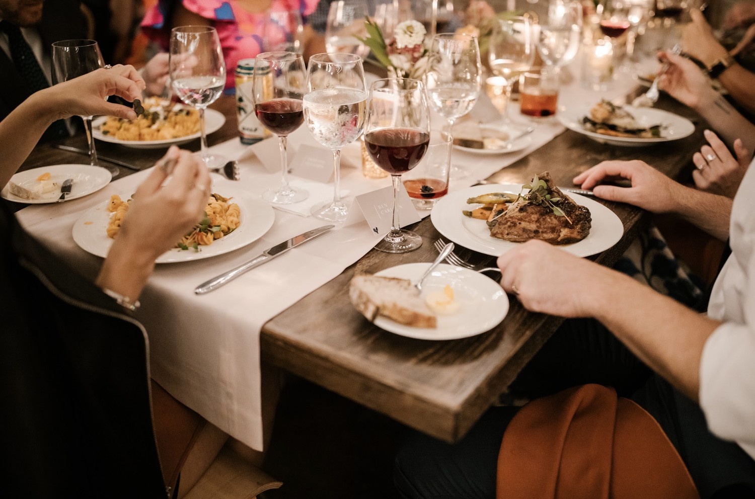 Professional wedding caterer serving elegant Indian dishes at wedding reception