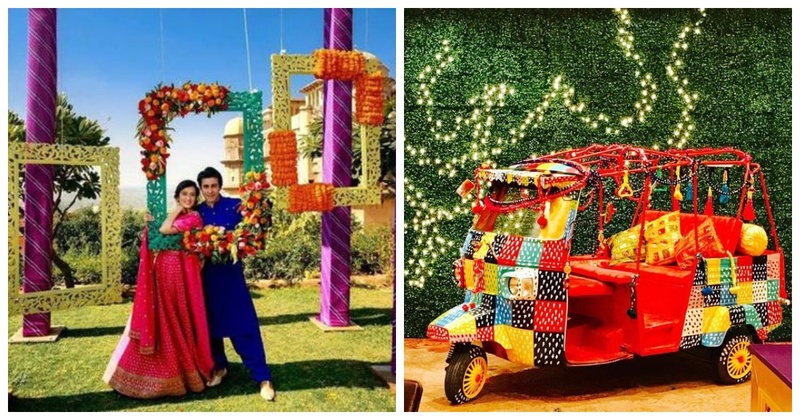 Colorful photo booth setup with Indian wedding props and decorations