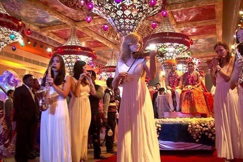 Wedding couple discussing contract details with professional artist and performer