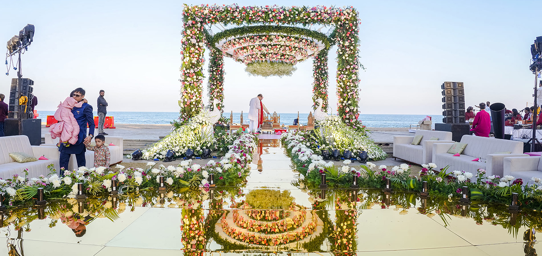 Beautiful beachside wedding setup at ECR with ocean waves and palm trees in Mahabalipuram