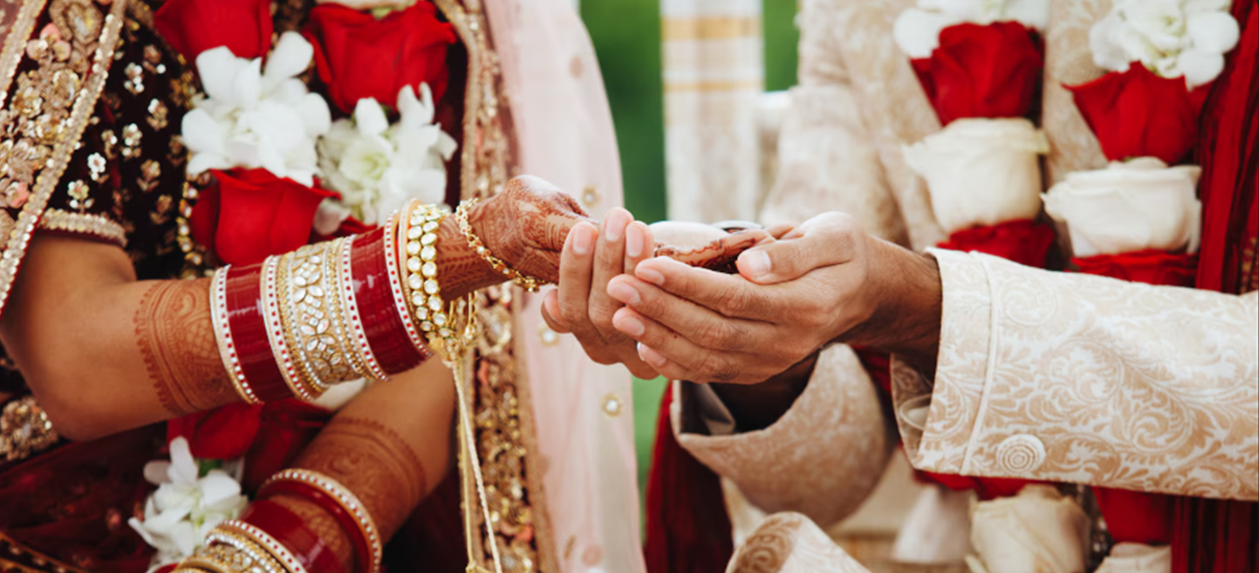 Beautiful interfaith wedding ceremony blending Hindu and Christian traditions with diverse floral arrangements