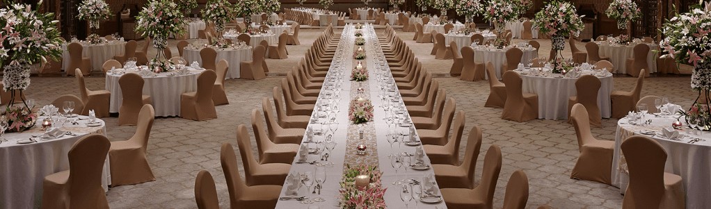 Large wedding halls for 1000 guests in Chennai decorated with marigold garlands and chandeliers