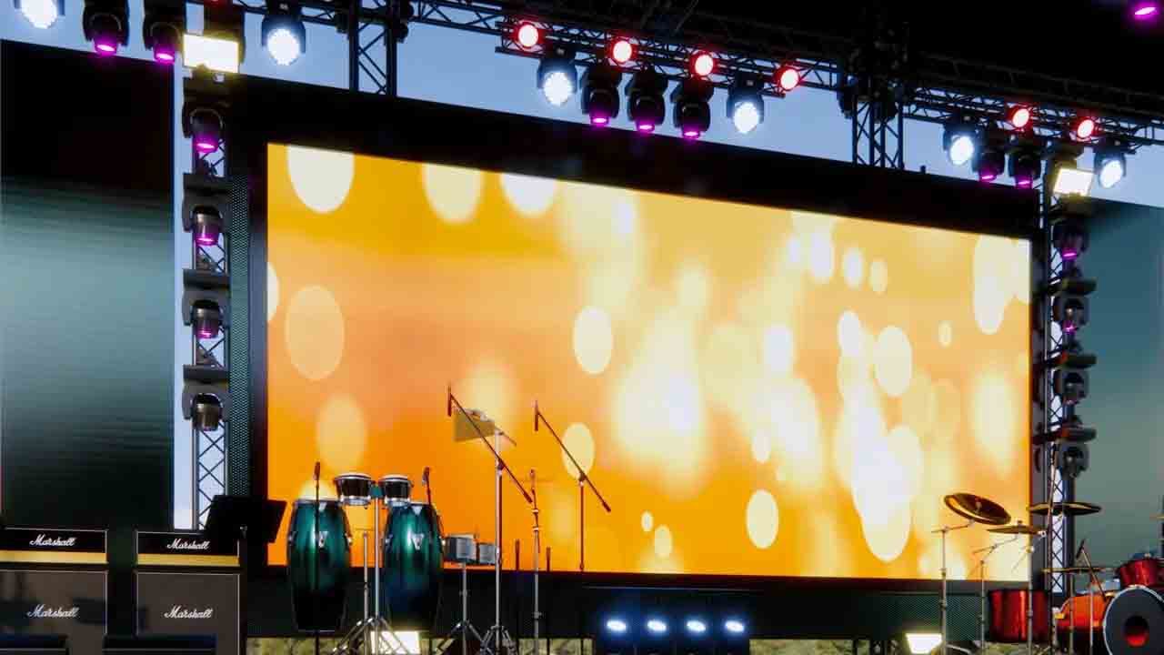 Large LED screen setup at a Chennai wedding venue with vibrant visuals and a packed guest audience