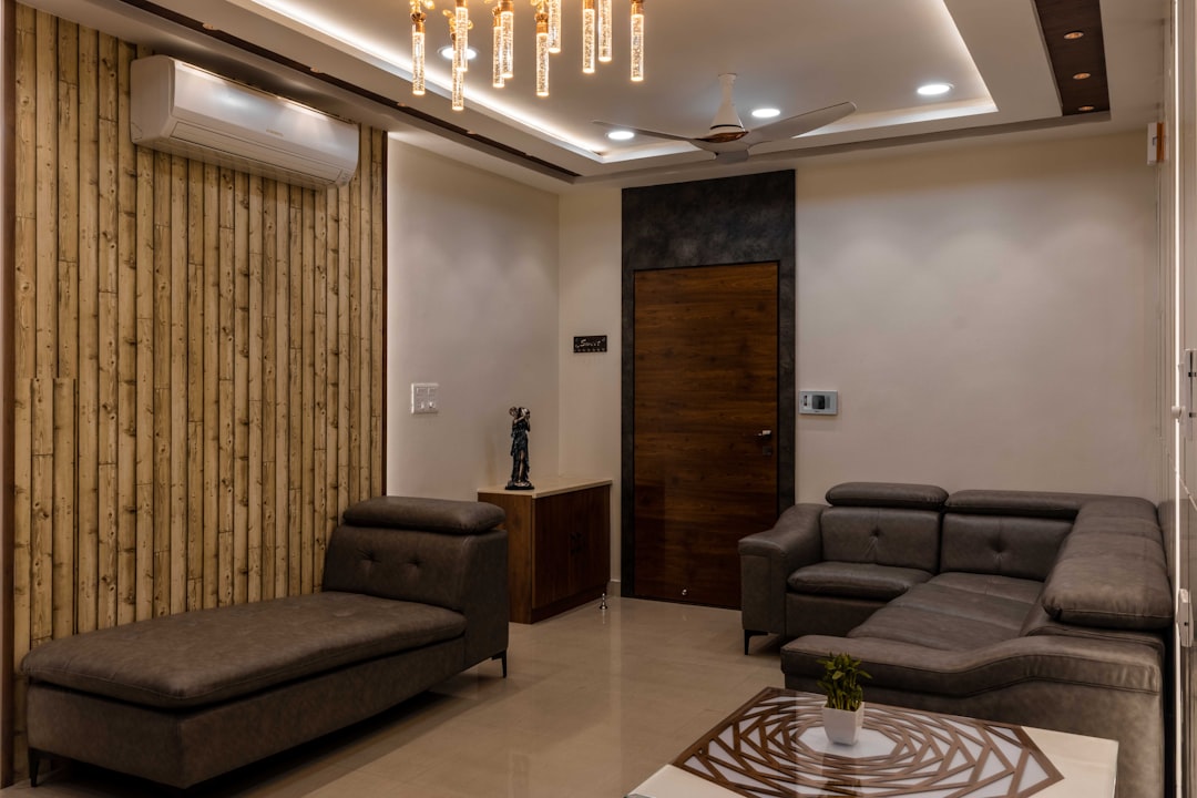 Elegant luxury furniture rental Chennai setup with gold thrones, draped chairs, and floral centrepieces at a South Indian wedding