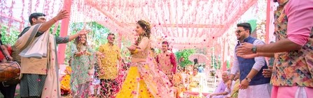 Luxury Wedding Petal Shower Chennai — couple walking under a cascade of fresh rose petals at a Chennai wedding venue