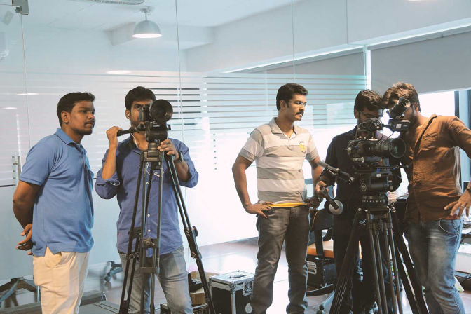 Professional networking event photography Chennai — photographer capturing delegates at a corporate mixer