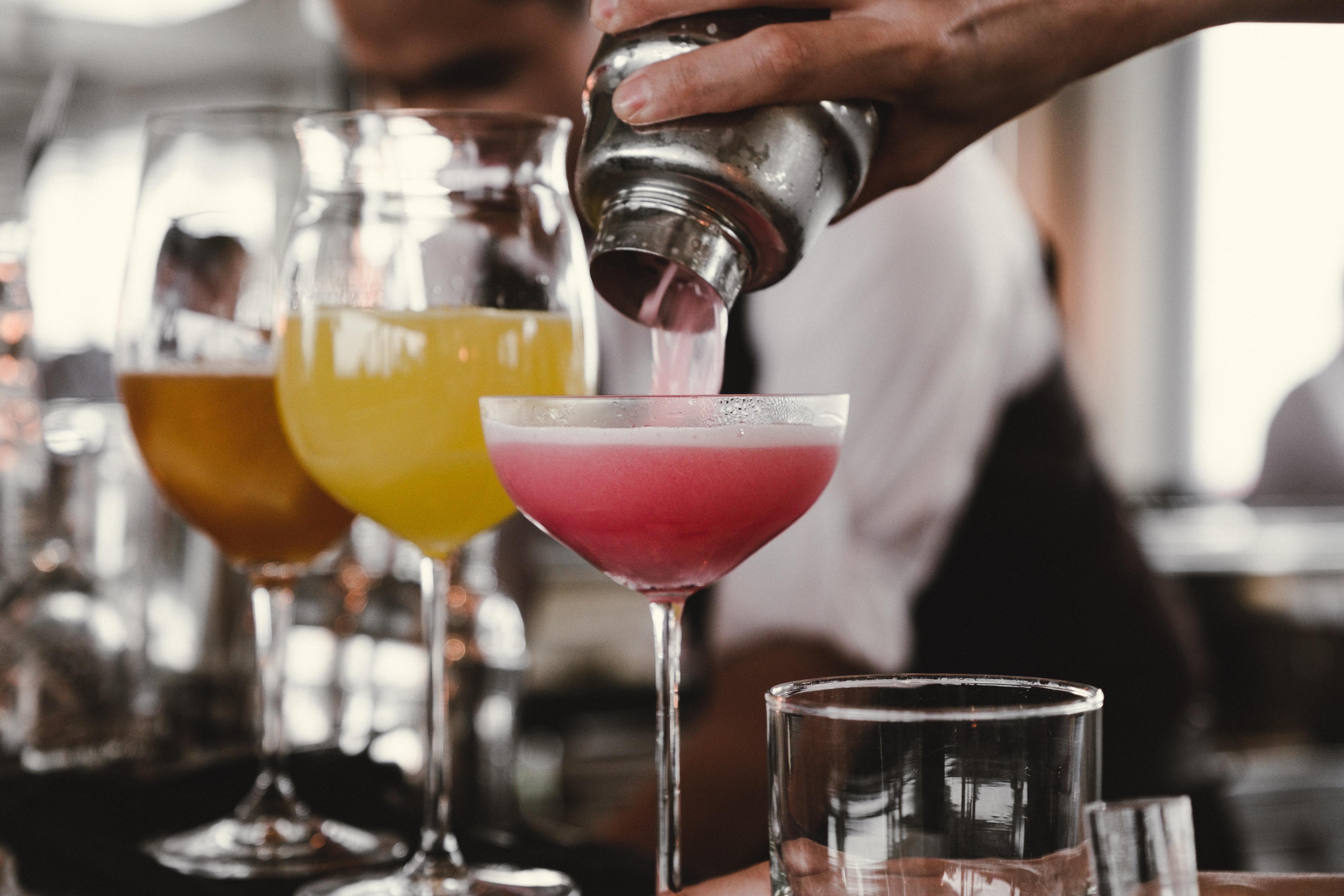 Elegant bar setup at Indian wedding reception with traditional and modern drinks