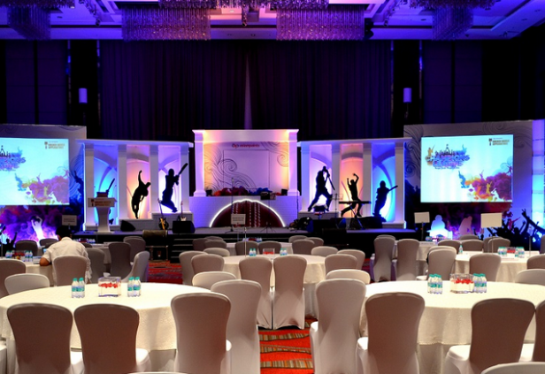 Elegant product launch decor Chennai with branded stage setup and floral arrangements