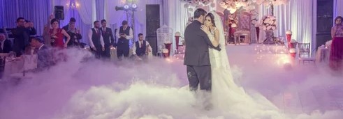 Reception dry ice effects Chennai — couple walking through a low-lying fog cloud at a Tamil Nadu wedding reception