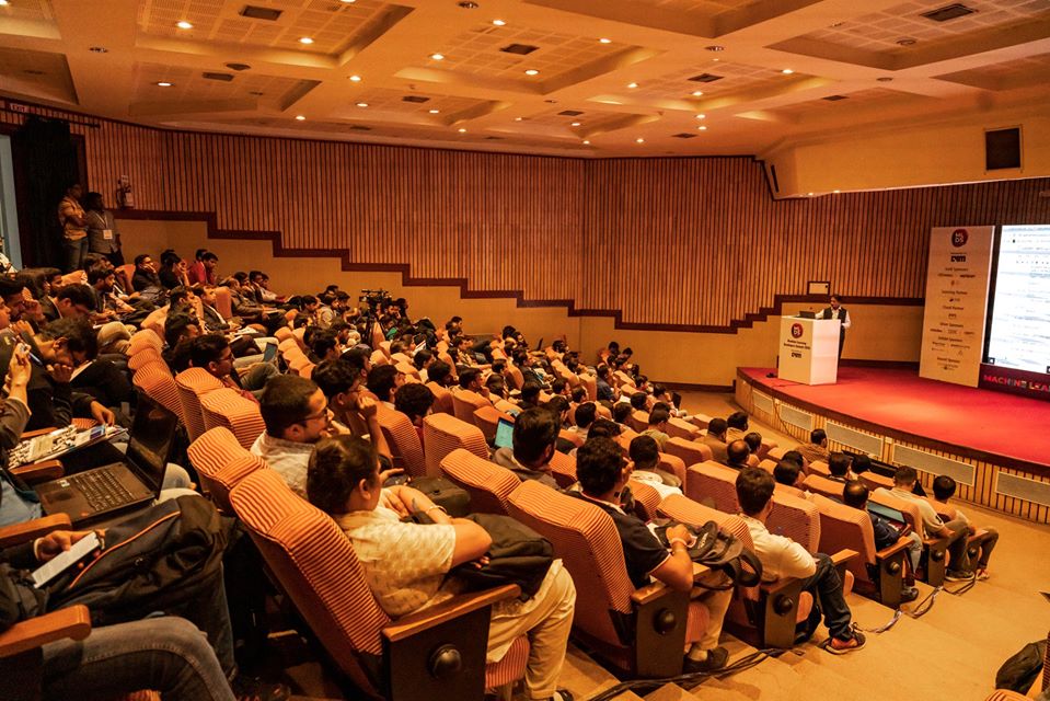 Professional seminar event planner Chennai setting up a corporate conference hall with projector and seating