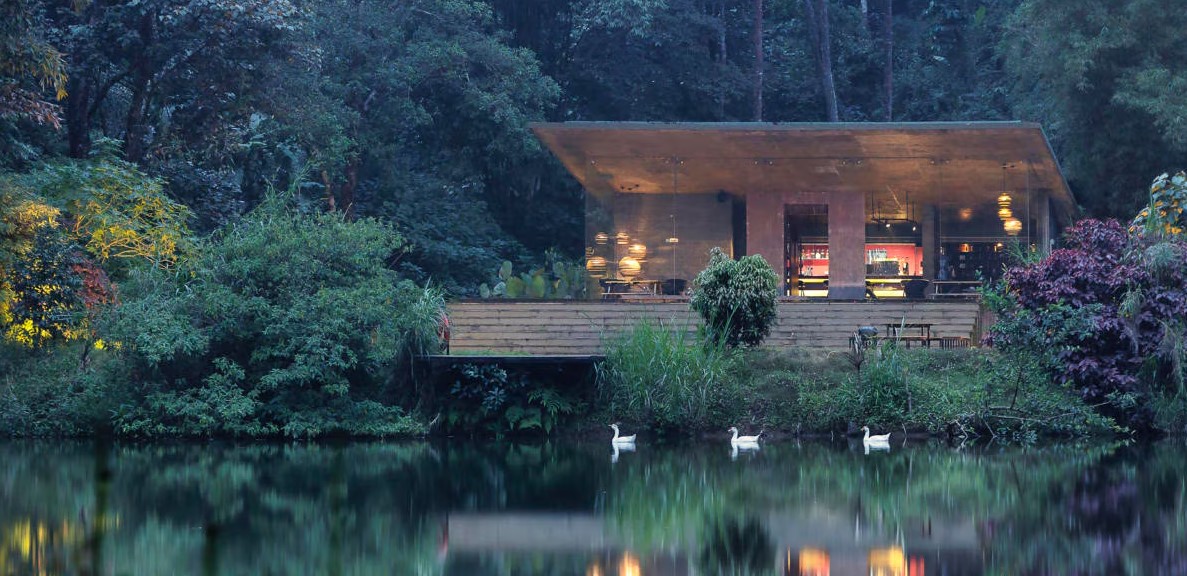 Luxury eco-friendly wedding resort with tropical landscaping and elegant outdoor ceremony setup