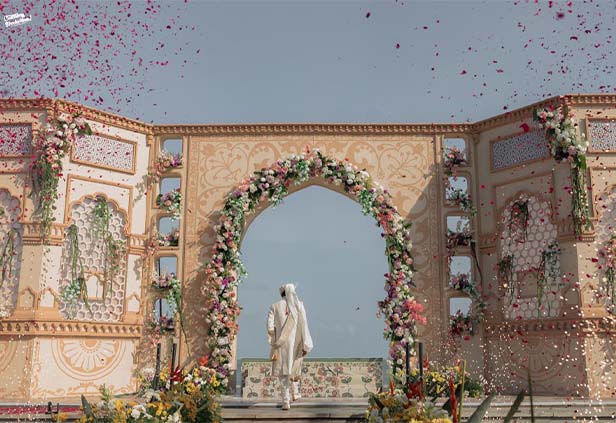 Royal themed varmala wedding stage with palace style backdrop decor