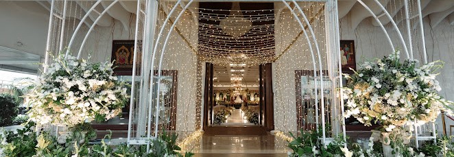 Wedding Petal Entry Chennai — bride and groom walking through a stunning floral petal shower corridor at a Chennai wedding venue
