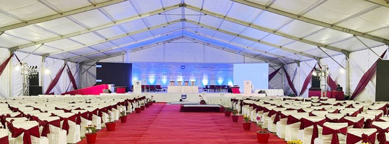 Elegant wedding tent rental Chennai setup with fairy lights and floral decorations at an outdoor venue