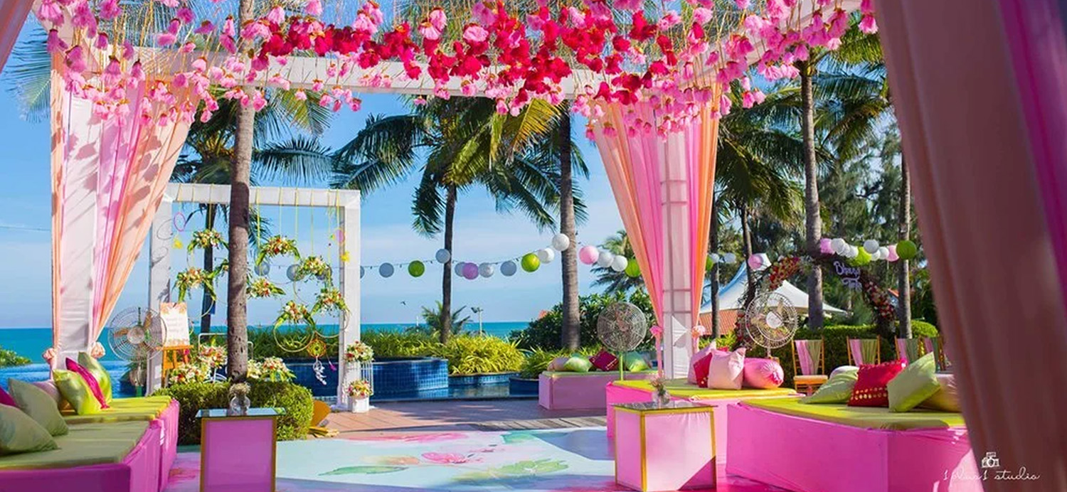 Elegant wedding setup at Temple Bay Resort beachfront with traditional decor and ocean views